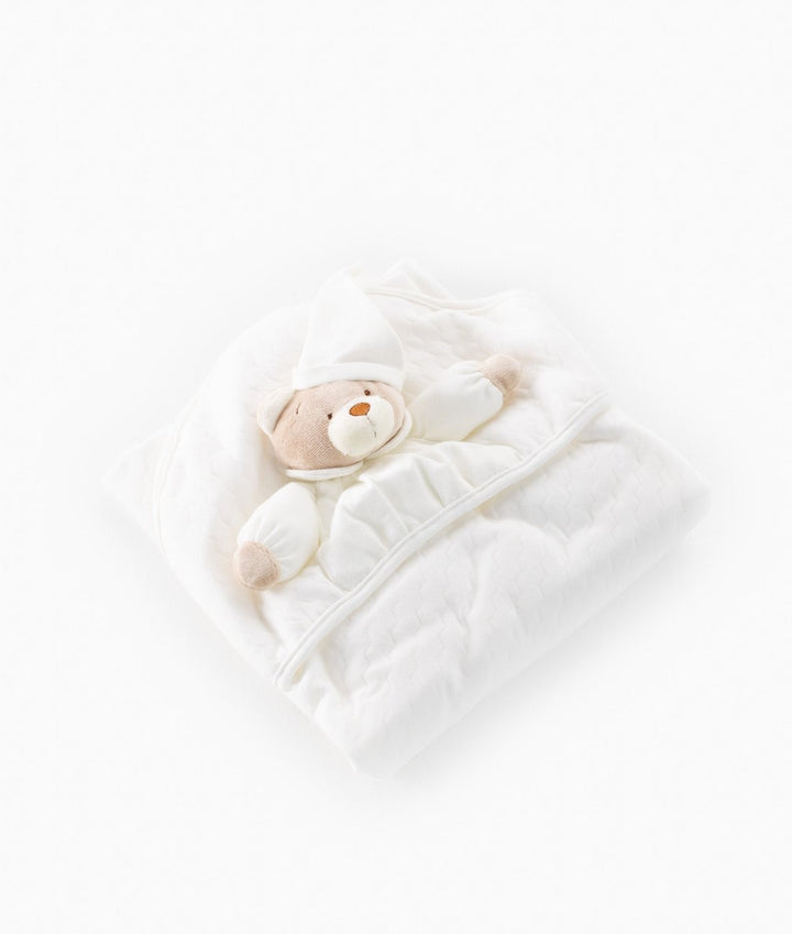 Beige and white quilted baby swaddle blanket with 3D teddy bear applique