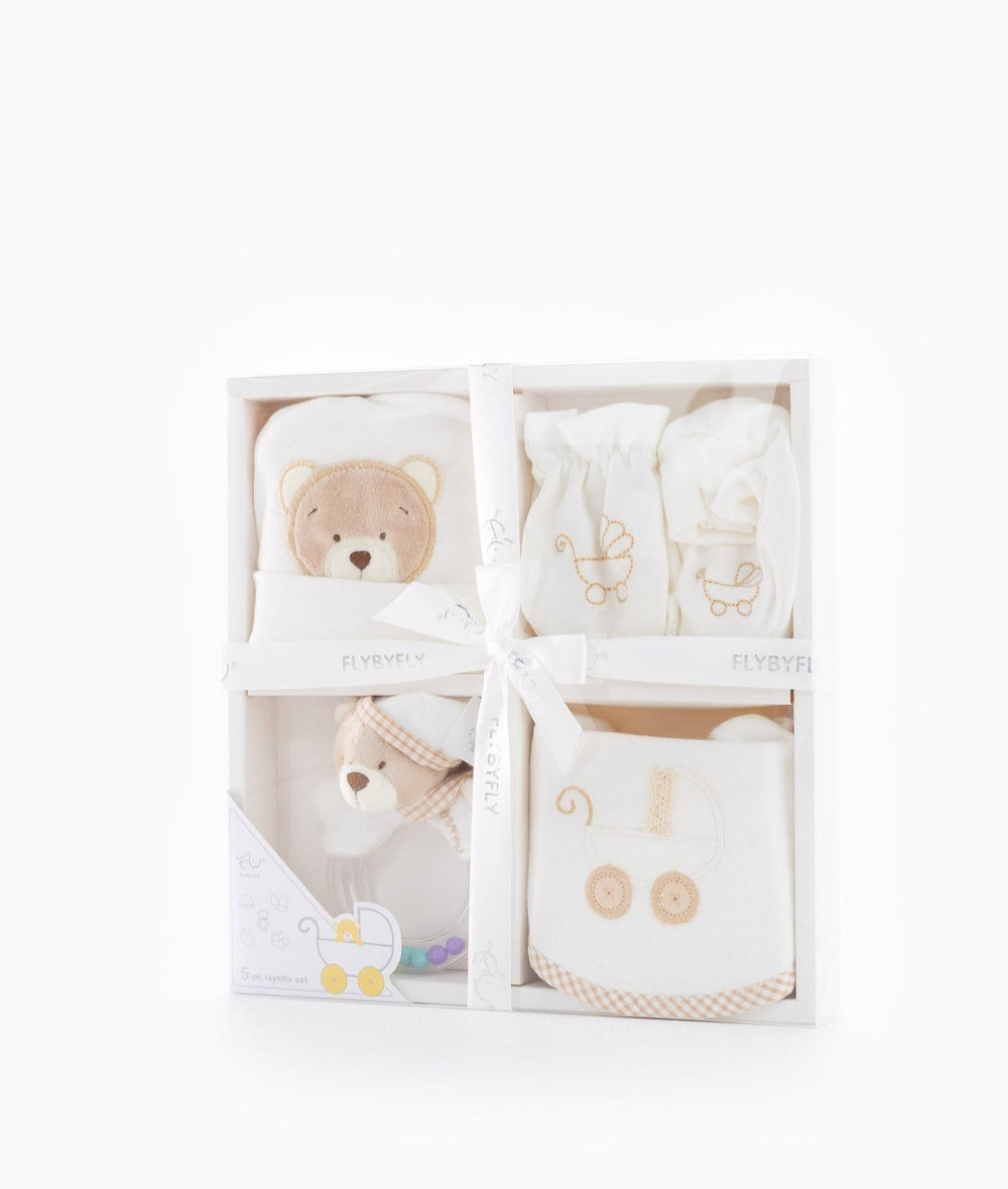 Packaged 5pc baby essentials gift set in white box with ribbon