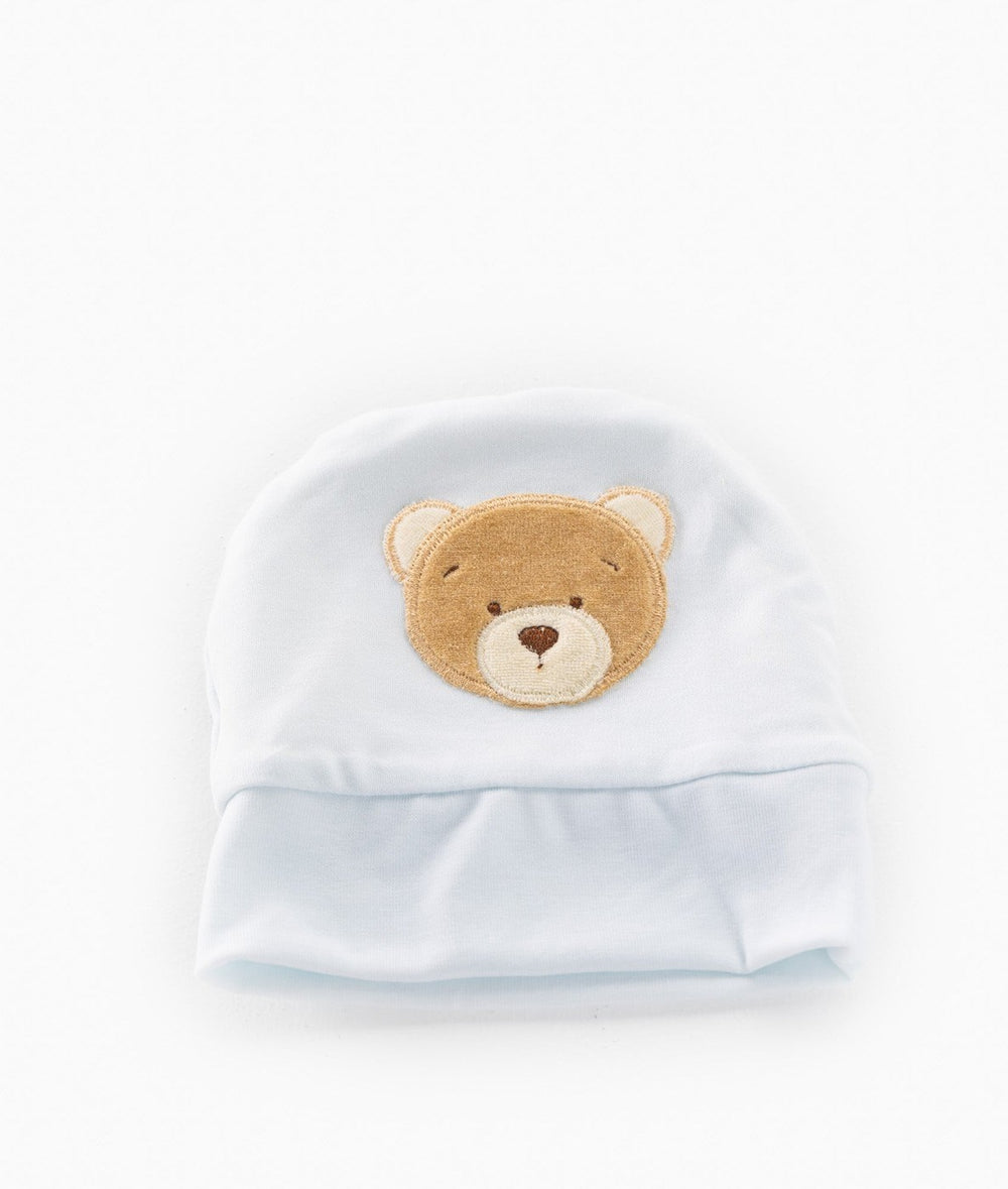 front shot of light blue cotton baby hat with centered brown bear applique and wide folded brim