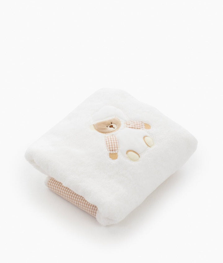 White terry cloth towel with embroidered bear and beige checkered border