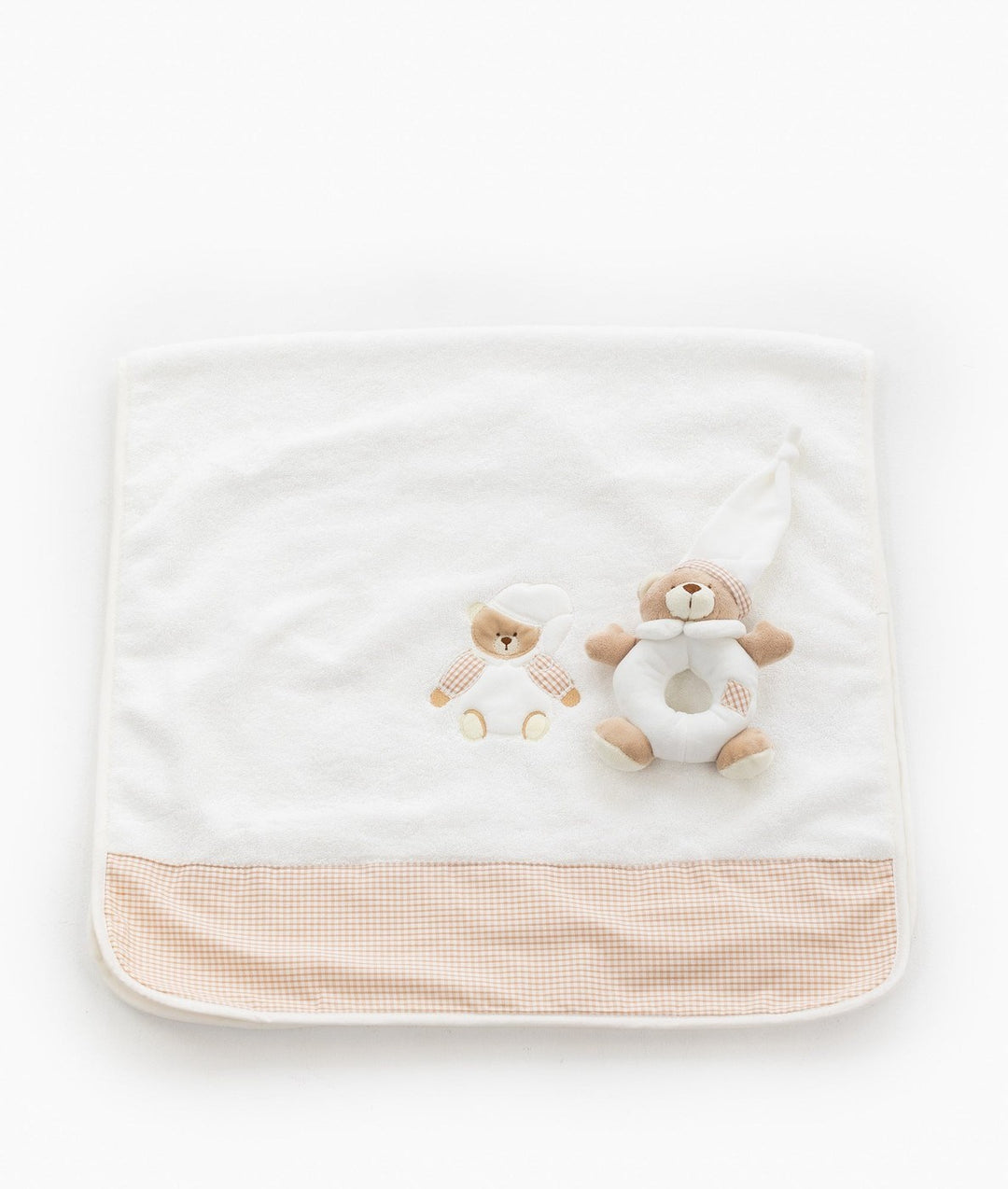Unfolded white bath towel with 3D bear rattle and wide gingham border