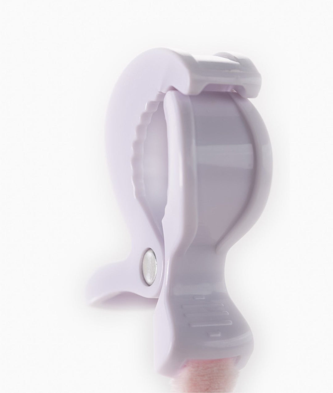 Close-up of white plastic clip hinge for attaching baby toys