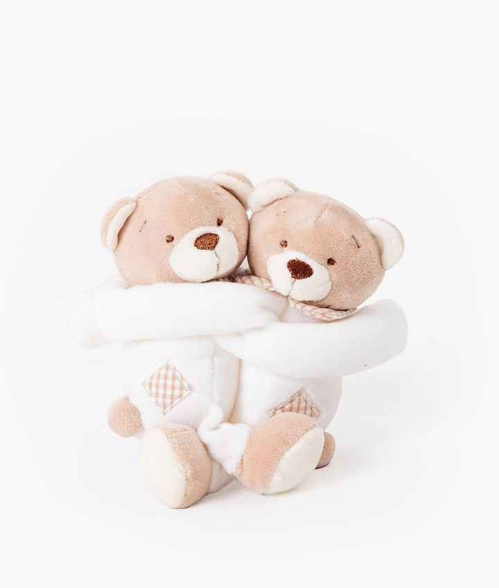 Two beige white plush teddy bear curtain tiebacks hugging side by side with checkered belly patches