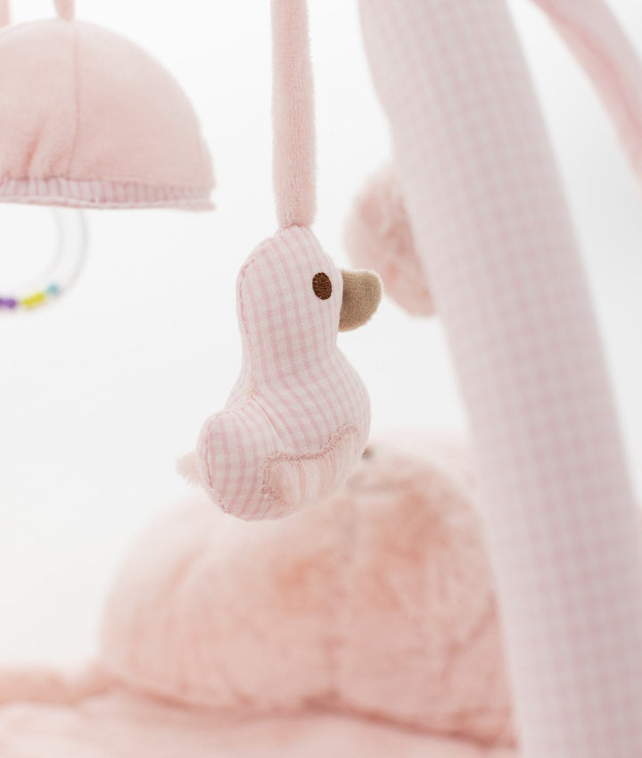 Hanging pink gingham bird sensory toy with checkered pattern and clear plastic rattle ring