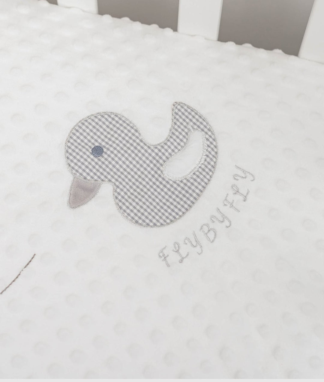 white minky dot fabric with embroidered grey gingham duck and branding