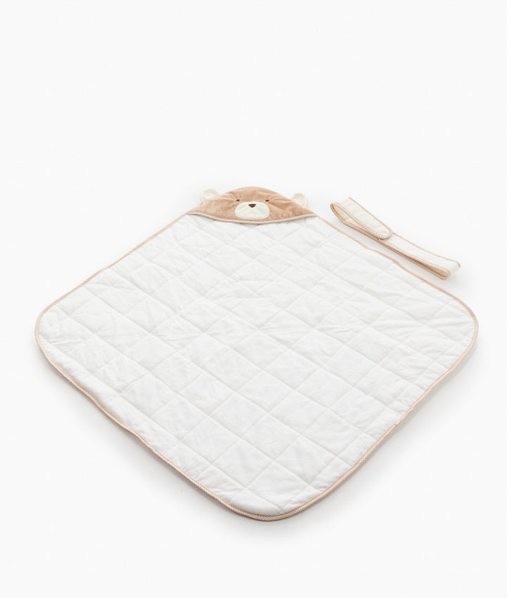 Beige and white hooded baby swaddle with diamond quilted cotton texture