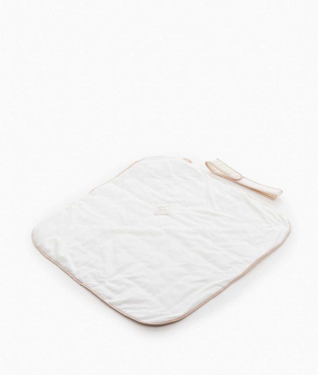 White cotton swaddle reverse side showing smooth texture and woven label