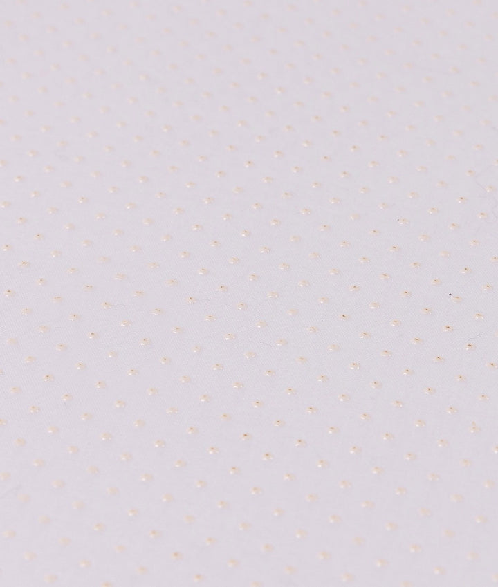 Macro shot of white anti-slip backing with raised rubber dot grid pattern for grip stability