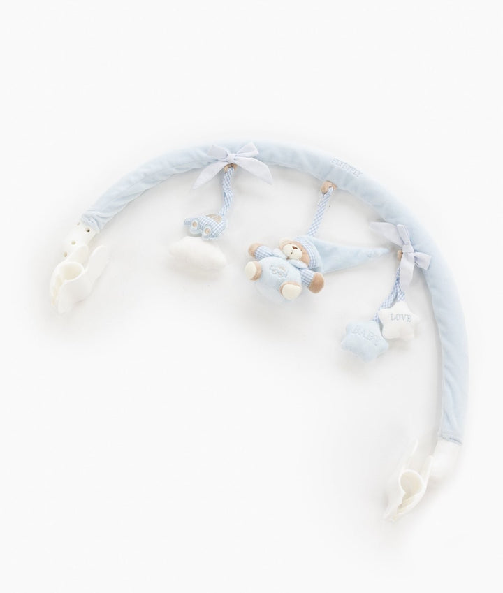 Blue baby activity arch flat lay showing white plastic clips and dangling plush toys on gingham ribbons