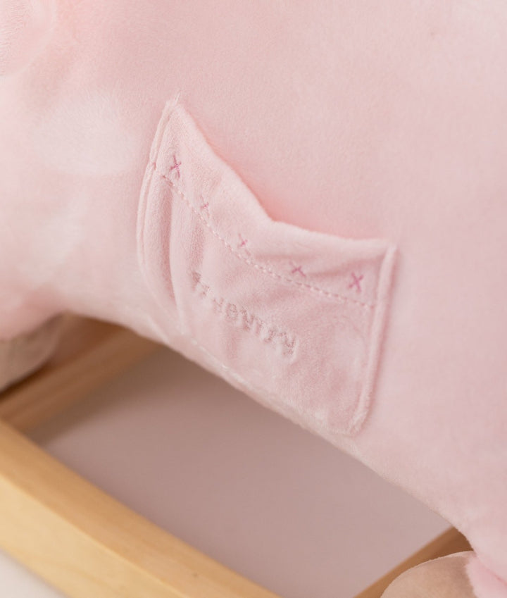 Detail of pink velvet patch pocket with cross-stitching
