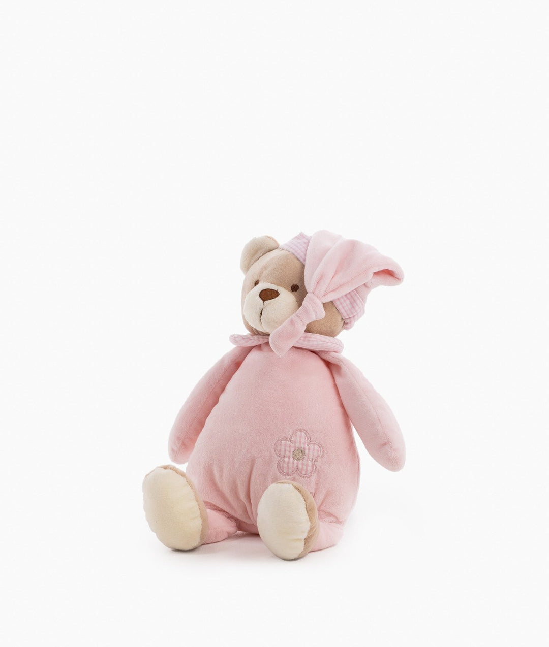 Three-quarter view of pink plush toy with gingham bonnet tie