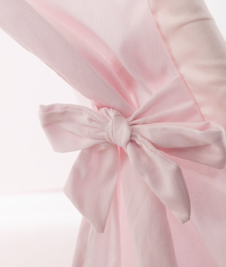 Close-up of pink ribbed cotton teepee fabric texture and stitching