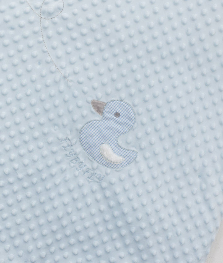 Close-up of light blue bubble fabric with gingham duck applique and embroidered logo