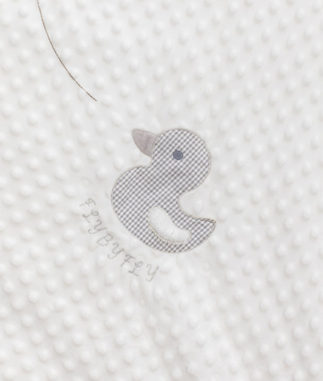 Grey gingham duck appliqué detail on white bubble quilt texture