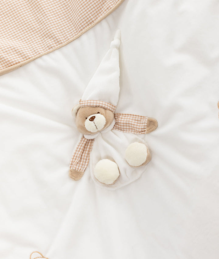 White and beige baby bassinet bedding